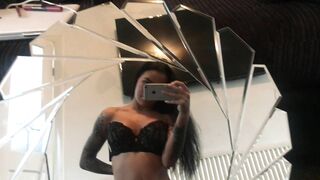 Mia Stryker caresses her pussy in front of a mirror